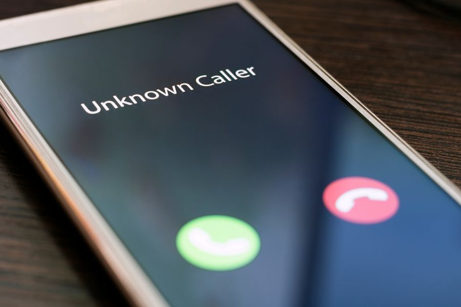 How to spot the signs of a pension scam - image shows a mobile phone with an unknown caller ringing.