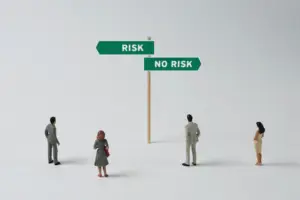 the investment gap blog - image of people looking at a sign which says risk one way and no risk the other